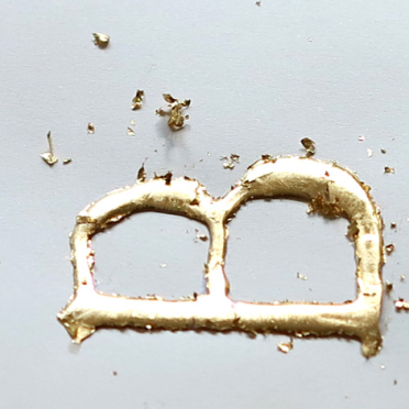 Gilding - brushing off excess leaf gold